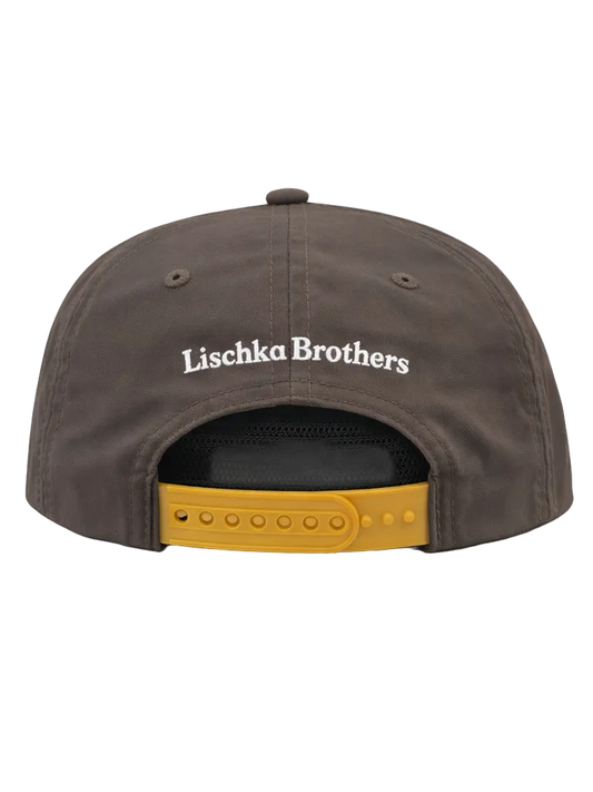 Brown cap with 'Lischka Brothers' logo on a white background
