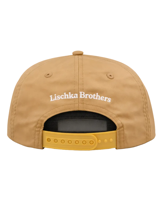 Tan cap with 'Lischka Brothers' logo on a white background