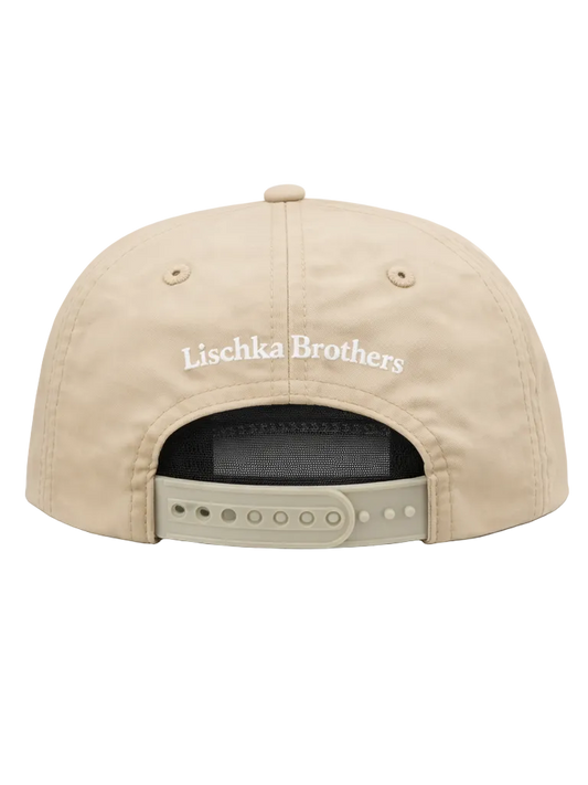 Beige cap with 'Lischka Brothers' logo on a white background