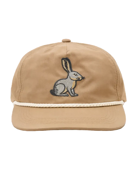 Beige cap with embroidered rabbit design on a white background