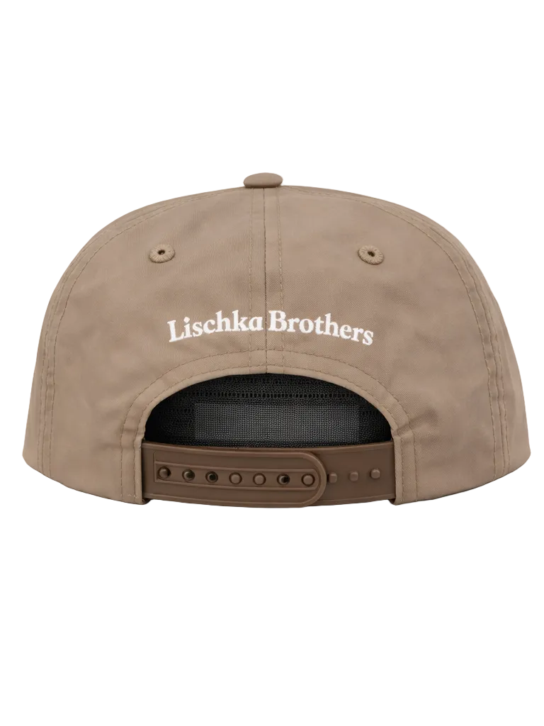 Brown cap with 'Lischka Brothers' logo on a white background