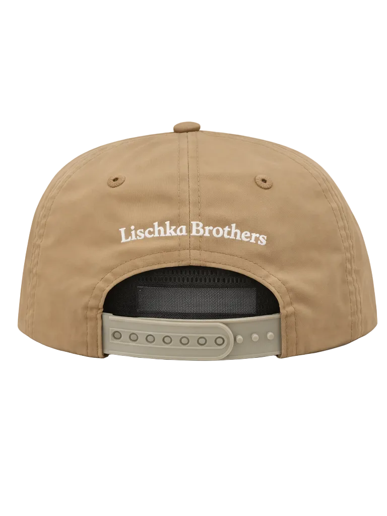Tan cap with 'Lischka Brothers' logo on the back against a white background