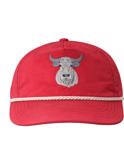 Red cap with a bull emblem and rope detail on a white background