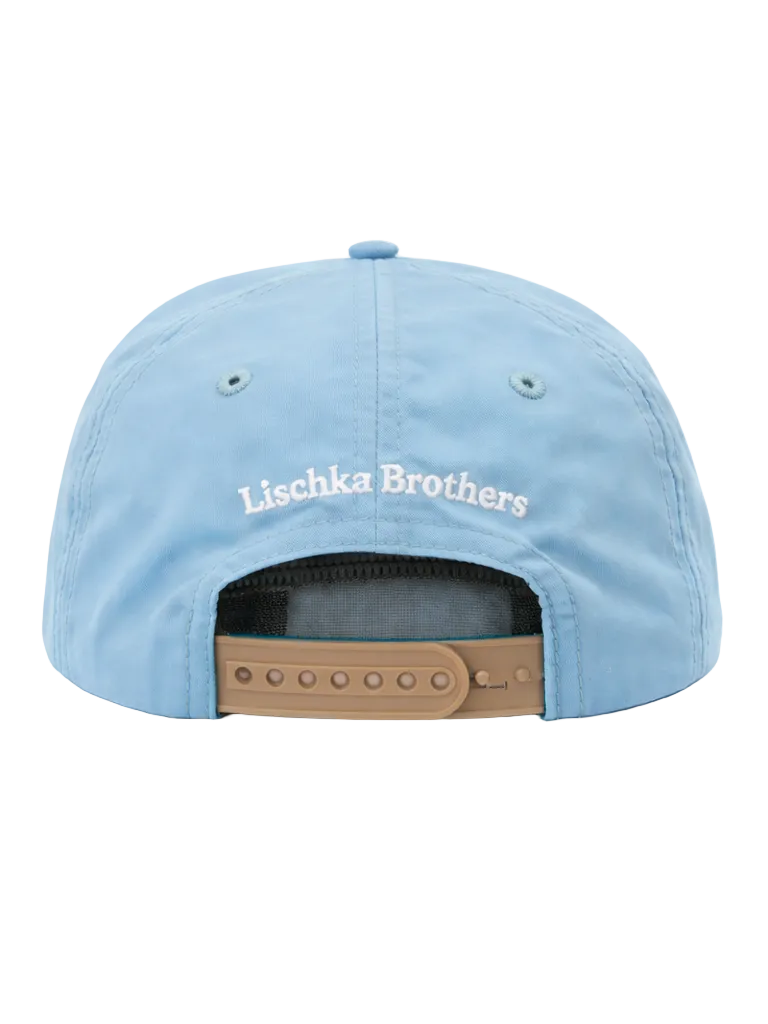 Light blue cap with 'Lischka Brothers' branding on a white background
