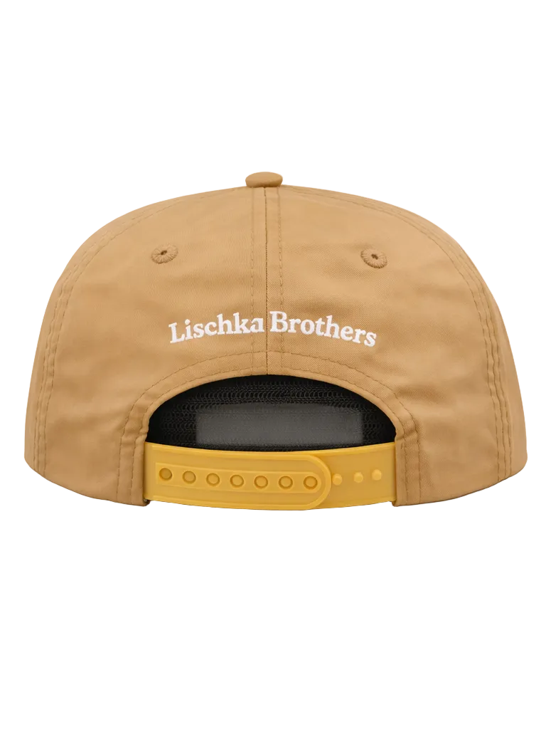 Tan cap with 'Lischka Brothers' logo on a white background