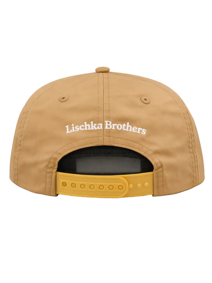 Tan cap with 'Lischka Brothers' logo on a white background