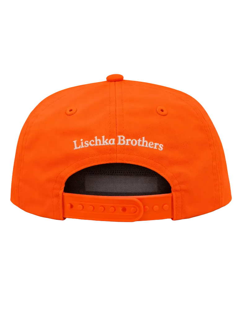 Orange cap with 'Lischka Brothers' branding on a white background