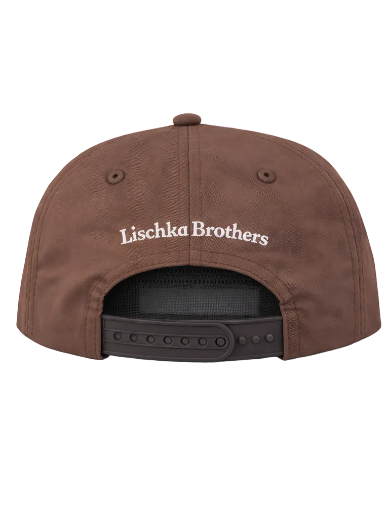 Brown cap with 'Lischka Brothers' logo on a white background