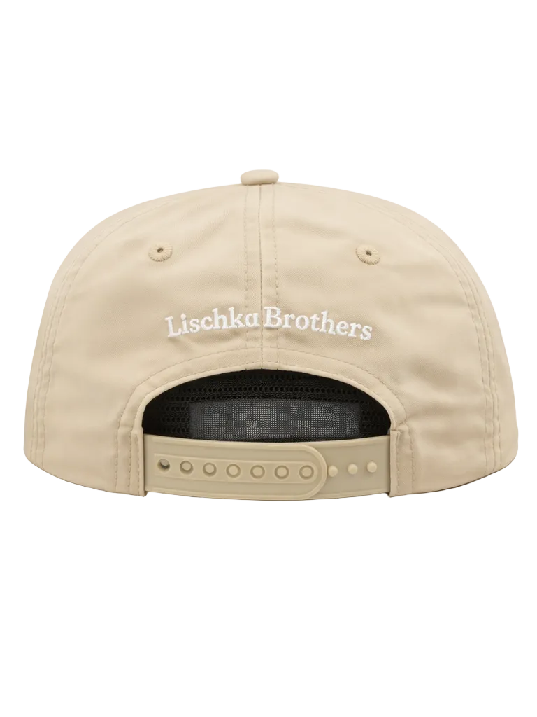 Beige cap with 'Lischka Brothers' logo on a white background