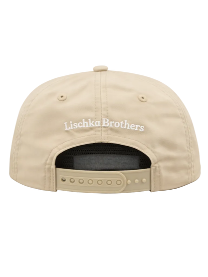Beige cap with 'Lischka Brothers' logo on a white background
